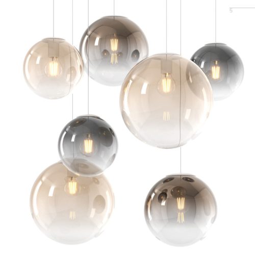 Collezione di lampade a sospensione composta da una o più sfere in vetro pirex soffiato regolabili in altezza e disponibili in diverse finiture e dimensioni.
